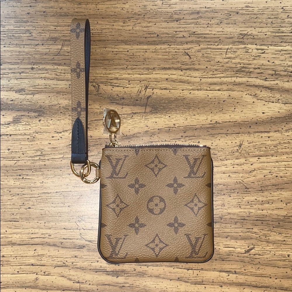 Square reverse monogram pouch w strap